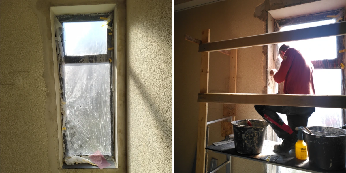 Person auf einem Gerüst verspachtelt die hohes Fenster